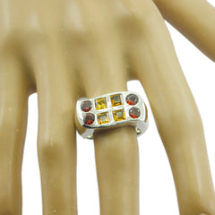 Teresa multicolor octa gemstone ring with yellow and red stones set in silver band on hand