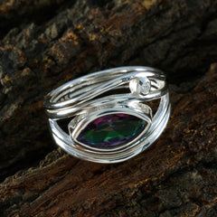 Teresa multicolor toi et moi ring with silver band and two stones on textured wood background