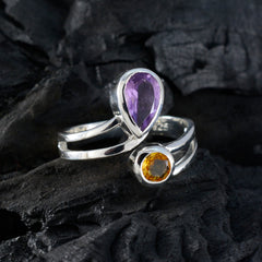 Ines silver multicolor toi et moi ring with purple and yellow gemstones on dark textured background