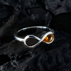 multicolor toi et moi ring in sterling silver with dark garnet and amber citrine stones on black rock