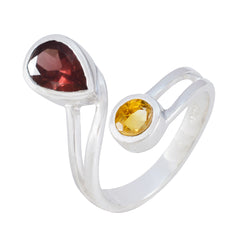 Araya multicolor toi et moi ring featuring pear-shaped red and round yellow gemstones in silver band