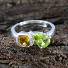 Olivia sterling silver multicolor Toi et Moi ring with cushion yellow citrine and pear shaped peridot on textured wood