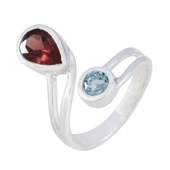 Isabelle silver multicolor toi et moi ring with red and blue gemstones in an open split band design