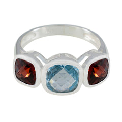 Ida multicolor trilogy gemstone ring with blue center stone and two red side stones in silver band
