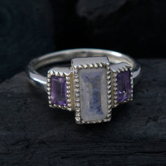 Natcha multicolor trilogy gemstone ring featuring a rectangular central stone flanked by two purple gems