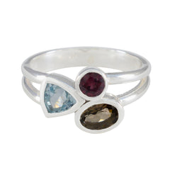 Mila multicolor trilogy gemstone ring with blue, red, and brown stones set in silver band