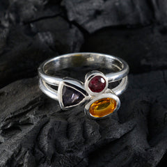 Lourdes multicolor trilogy gemstone ring with purple, red, and yellow stones set in silver band