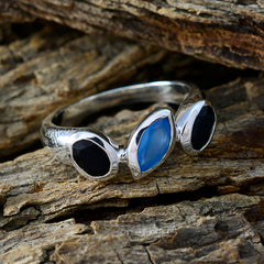Paula silver multicolor trilogy gemstone ring with blue and black stones on textured wood