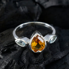 Kennedy multicolor trilogy gemstone ring with pear-shaped orange and blue gemstones in silver setting