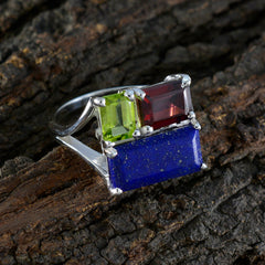 Dewi multicolor trilogy gemstone ring with green, red, and blue stones set in silver band