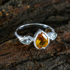 Kennedy multicolor trilogy gemstone ring with pear-shaped yellow and blue stones in silver setting