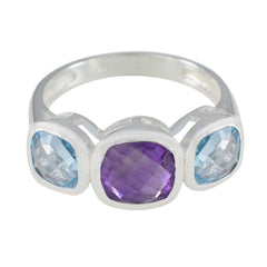 Hazel multicolor trilogy gemstone ring with a purple center stone and two blue side stones set in silver