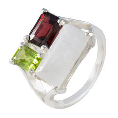 Mathilde multicolor trilogy gemstone ring with red, green, and white stones in silver setting