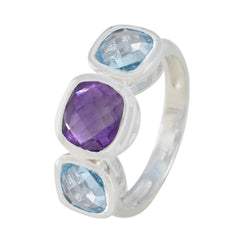 Hazel multicolor trilogy gemstone ring with purple and blue faceted stones set in silver band
