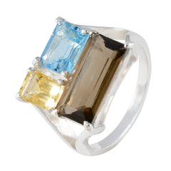 Rebeca multicolor trilogy gemstone ring with blue, yellow, and brown rectangular stones set in silver band