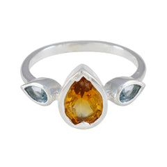 Kennedy multicolor trilogy gemstone ring with pear-shaped orange and blue stones in silver band