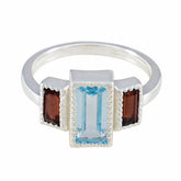 Elena sterling silver multicolor trilogy ring with rectangular blue center stone and two red garnet side stones