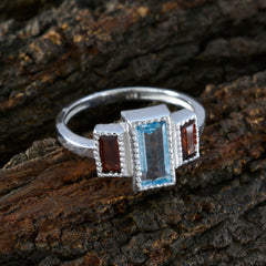 Elena multicolor trilogy ring with rectangular blue center stone and two red side stones on silver band for everyday wear