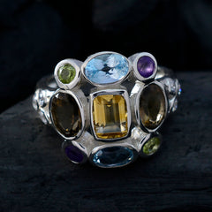 Liyana Navratna gemstone ring featuring multicolored gemstones set in a silver band