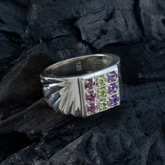 Lakshmi Navratna gemstone ring for women featuring multicolored stones set in a silver band