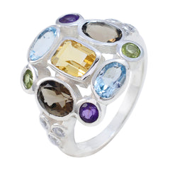 Liyana Navratna gemstone ring with multicolored oval and rectangular gemstones set in silver band