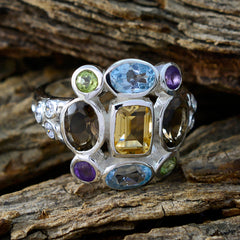 Liyana Navratna gemstone ring with colorful oval and rectangular stones set in silver band