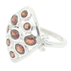 Carla silver navratna gemstone ring with multiple red gemstones set in an intricate design