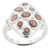 Carla silver navratna gemstone ring with multiple round red gemstones in a square setting