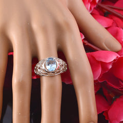 Nova Filigree Blue Solitaire Ring Elegant Design