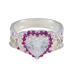 Yasmin pink halo gemstone ring with heart-shaped center stone and surrounding pink and clear gemstones