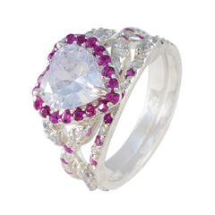 Yasmin pink halo gemstone ring with a heart-shaped center stone and intricate silver band detailing