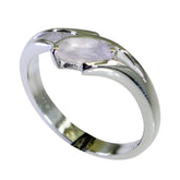 Jia pink solitaire ring for women with a silver band and oval pink gemstone centerpiece