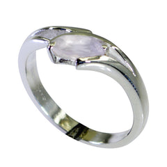 Jia pink solitaire ring for women with a silver band and oval pink gemstone centerpiece