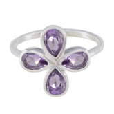 Natalie sterling silver purple floral gemstone ring with four pear cut amethyst stones arranged in a flower design