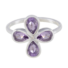 Natalie sterling silver purple floral gemstone ring with four pear cut amethyst stones arranged in a flower design
