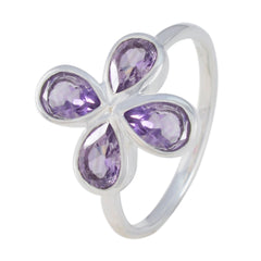 Natalie silver ring with four pear shaped amethyst petals forming a floral design purple floral gemstone ring