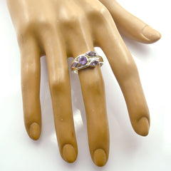 Carolina silver ring with three oval purple gemstones on mannequin hand purple gemstone ring for women