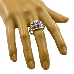 Katarina purple gemstone ring with multiple round stones set in silver band on hand model