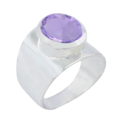 Fernanda purple gemstone solitaire ring with wide silver band and round faceted purple stone