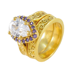 Katharina gold filigree ring with large clear center stone and halo of purple gemstone statement ring