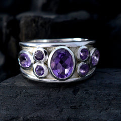 Nayara purple gemstone statement ring with multiple faceted purple stones set in silver band