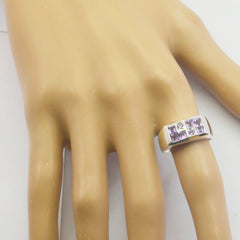 Pauline silver band purple gemstone statement ring with four square stones shown on mannequin hand