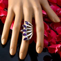 Giulia purple gemstone statement ring with five marquise stones on silver band displayed on mannequin hand