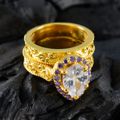 Katharina gold filigree ring with pear shaped clear center stone haloed by purple gems purple gemstone statement ring