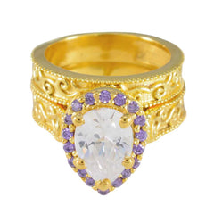 Katharina gold ornate ring with pear clear center stone and halo of purple gems purple gemstone statement ring