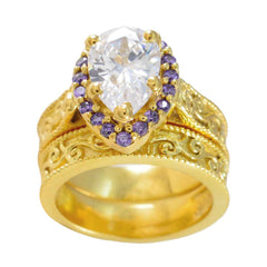 Katharina gold filigree ring with pear shaped clear center stone and halo of amethyst accents purple gemstone statement ring
