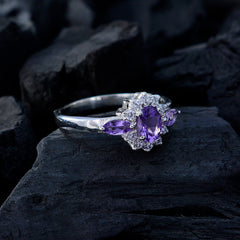Lily purple gemstone trilogy ring with oval center stone and marquise side stones on silver band