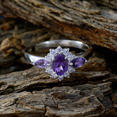 Lily purple gemstone trilogy ring with a central oval stone and side marquise gems on silver band