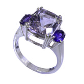 Carolina purple gemstone trilogy ring with cushion center stone and two round purple side stones in silver setting