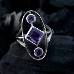 Renata purple gemstone trilogy ring with three purple stones set in a unique silver band design